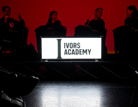The Ivors Academy logo lit up at a conference