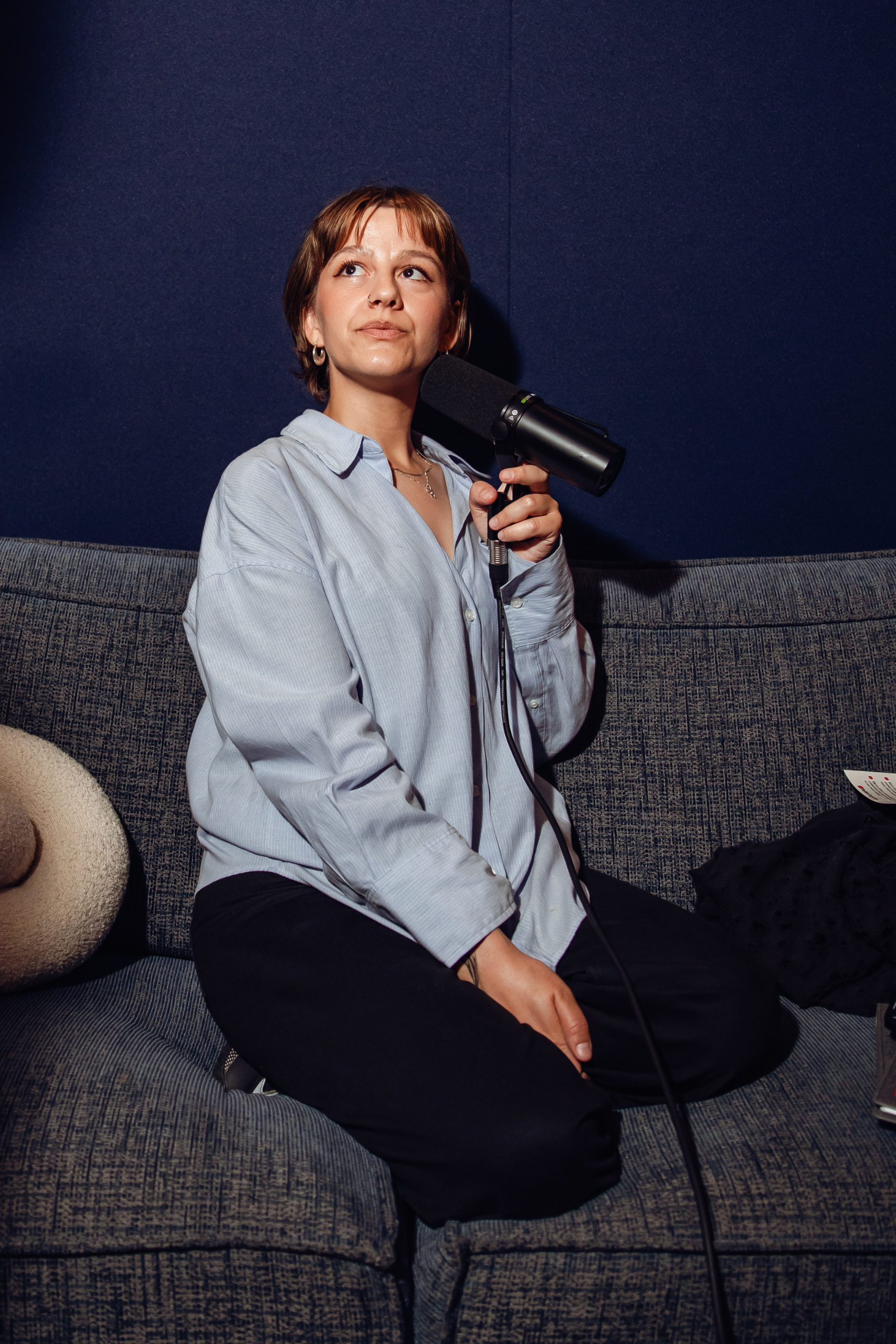 Woman holding mic on writing camp